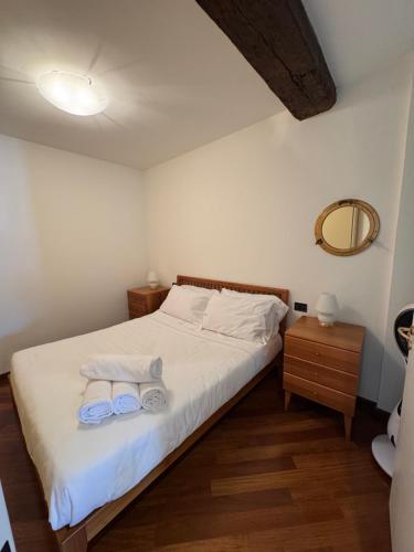 a bedroom with a bed with two towels on it at Finestra sul Mare di Maury in Portovenere