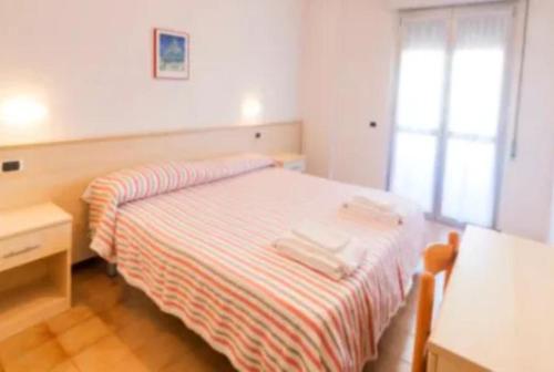 Postel nebo postele na pokoji v ubytování Hotel Holiday Garnì