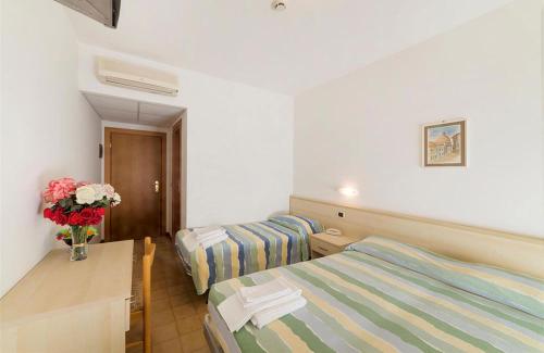 Postel nebo postele na pokoji v ubytování Hotel Holiday Garnì