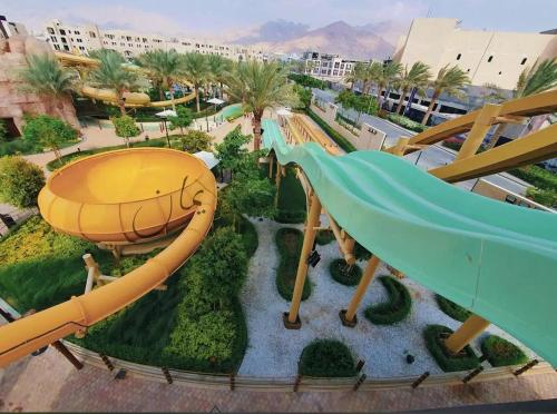 an aerial view of a water park with a slide at Old Town Hotel in Aqaba