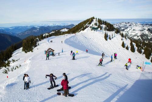 a group of people on a snow covered ski slope at You Deserve the Best! in Tacoma