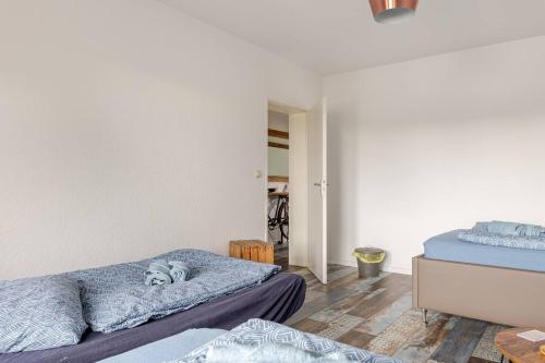 Ένα ή περισσότερα κρεβάτια σε δωμάτιο στο Charming Zimmer Köln Messenähe