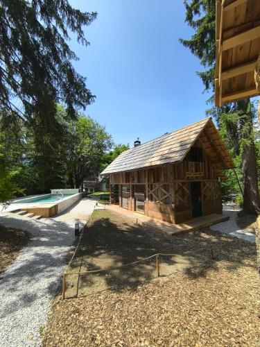 a small wooden building with a ramp in front of it at Ribno Alpine Glamping in Bled