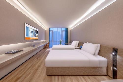 TV a/nebo společenská místnost v ubytování Crystal Orange Beijing South Railway Station Xitieying Hotel