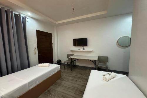 Ένα ή περισσότερα κρεβάτια σε δωμάτιο στο Hotel Ramon