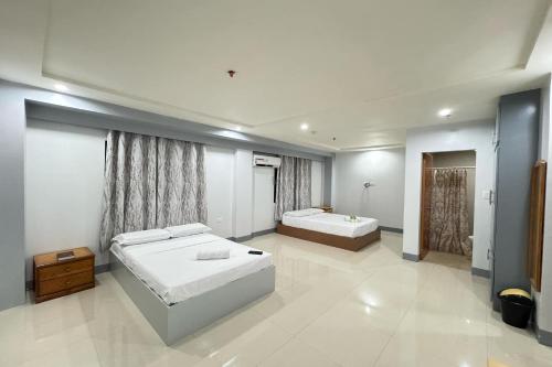 Postel nebo postele na pokoji v ubytování Hotel Ramon