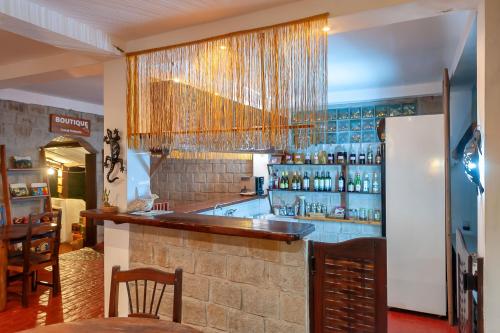 a bar in a restaurant with a counter at A casa di Giorgia lodge Nosy be Andilana in Nosy Be