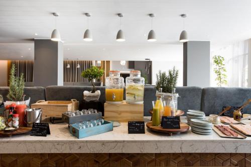 a table with food and drinks on top of it at Radisson Blu Hotel Antananarivo Waterfront in Antananarivo