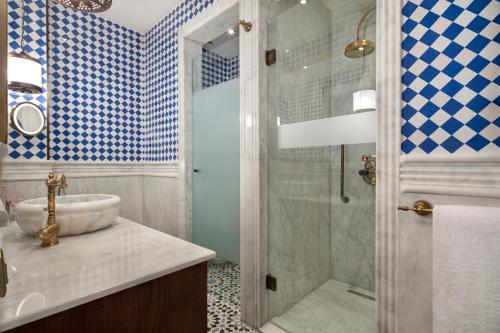 a bathroom with a sink and a shower at Hagia Sofia Mansions Istanbul, Curio Collection by Hilton in Istanbul