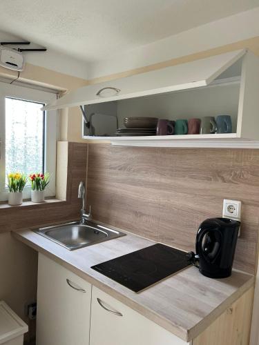 a kitchen with a sink and a counter top at Pension Highway - Löhne Löhner Straße 111 in Löhne