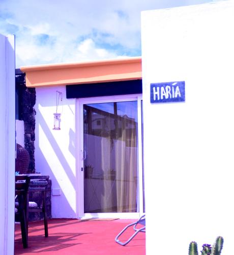 a door to a building with a sign that reads hacienda at HOTELITO RURAL GA7COLORES only adult in Montaña Blanca