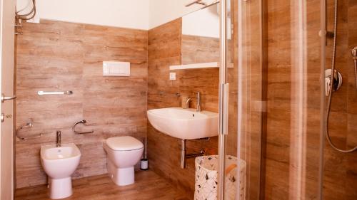 a bathroom with a sink and a toilet and a shower at Teuladamar by Rentbeat in SantʼAnna Arresi