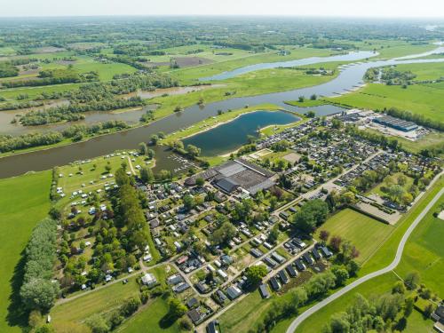 an aerial view of a park next to a river at De Scherpenhof in Terwolde