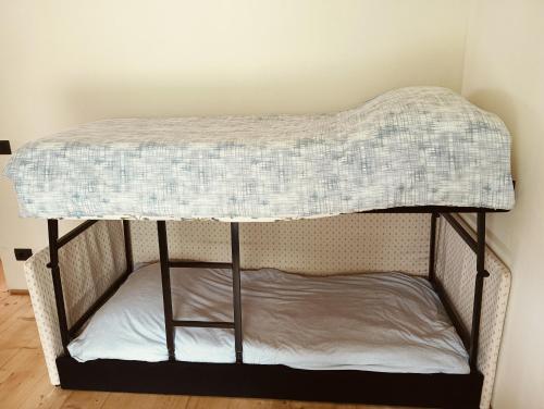 a bunk bed with a mattress on top of it at Casa Aurea in Bossico