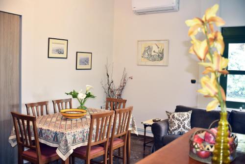 a dining room with a table and chairs at Angelica's House in Pythagoreio