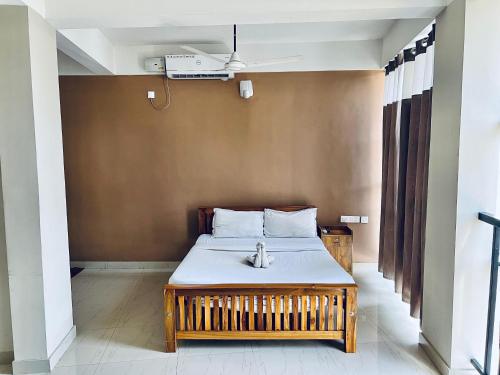 Cama o camas de una habitación en Solo Simrin Arcade Kadavanthra