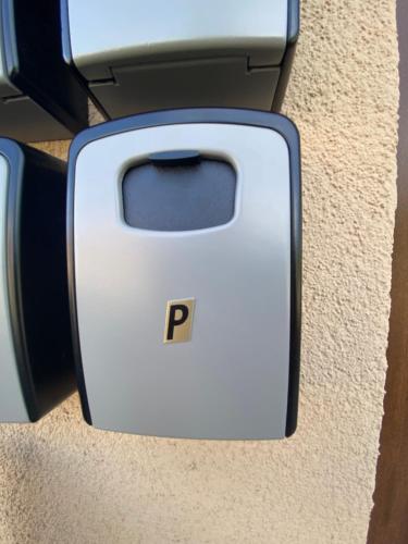 a white toaster with the letter p on it at Apartmán KUGA in Mikulov