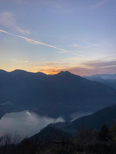a view of a lake in the mountains at sunset at casa Veronica in Pieve Di Ledro