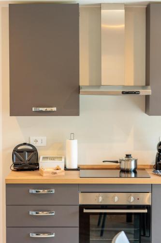 Dapur atau dapur kecil di Revo Apartments - Meriggio