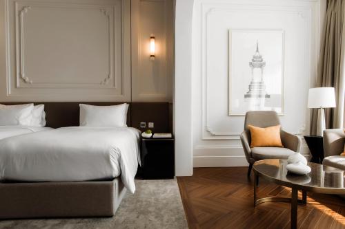 Ένα ή περισσότερα κρεβάτια σε δωμάτιο στο Souphattra Hotel Vientiane