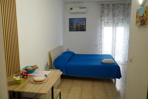 A bed or beds in a room at B&B La Dimora di Rosa