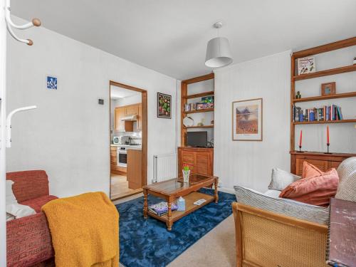 a living room with a couch and a table at Pass the Keys Cosy Garden Home in Canterbury