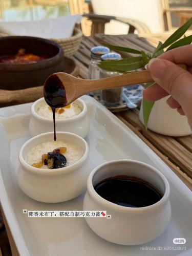a spoonful of food on a tray with coffee at Tanirt ecolodge in Siwa