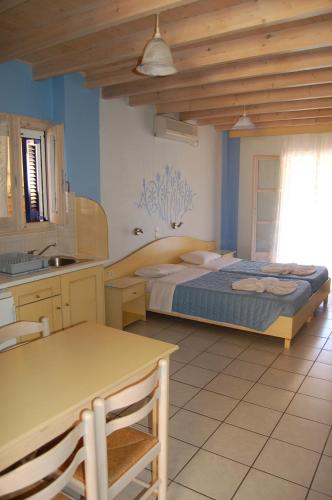 Ένα ή περισσότερα κρεβάτια σε δωμάτιο στο Angelina Apartments
