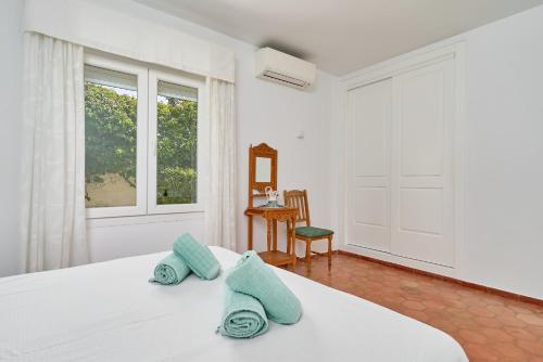 Postel nebo postele na pokoji v ubytování Villa La Chinita