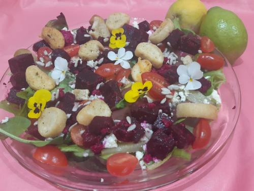 a salad in a glass bowl on a pink table at Lavender Lane in Ladysmith