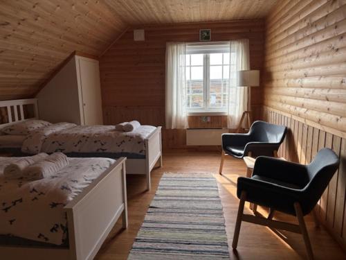 Postel nebo postele na pokoji v ubytování Slettnes Fyr