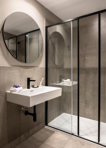 a bathroom with a sink and a mirror at Hotel Principe Di Villafranca in Palermo