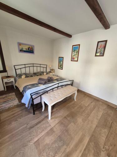 a bedroom with a bed and a bench in it at Stana Apartment in Poreč