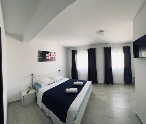 Postel nebo postele na pokoji v ubytování Apartments Marina