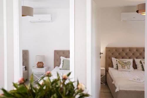 Posteľ alebo postele v izbe v ubytovaní Apartamenty na Dworskiej - BLISKO ENERGYLANDIA ZATORLAND