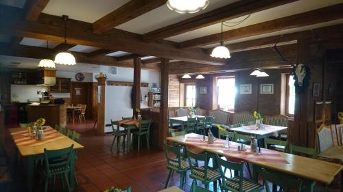 a restaurant with tables and chairs in a room at Landgasthof Hummel in Ebensfeld
