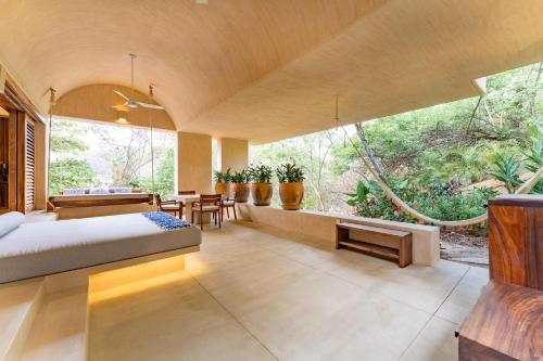 a bedroom with a bed and a large window at 3064 - Casa Charra in Valerio Martínez