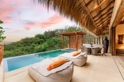 a villa with a swimming pool and a resort at 3064 - Casa Charra in Valerio Martínez
