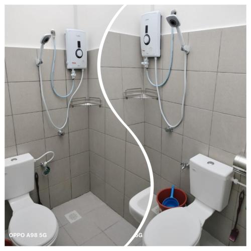a bathroom with two toilets and a shower at The Road Stay in Kluang