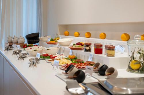 a buffet with many different types of food on a table at Aegean Houses in Kos Town