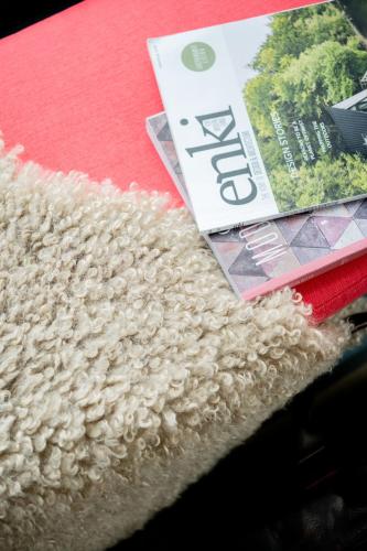 a magazine sitting on a table next to a rug at The Art Loft in Kingsbridge