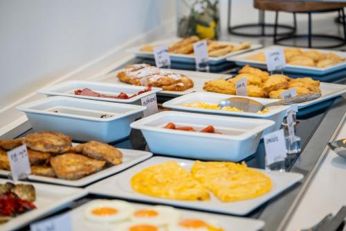 a buffet of different types of food on a table at Aegean Houses in Kos Town
