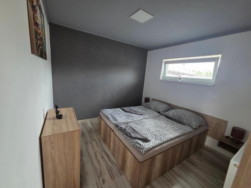 Ένα ή περισσότερα κρεβάτια σε δωμάτιο στο Alexej apartmany