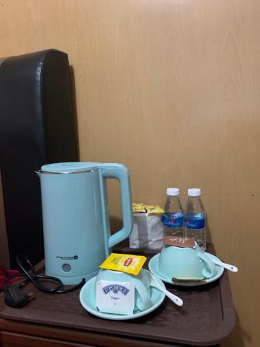 a counter with a blender and two bottles of water at Anis View Chalet in Perhentian Island