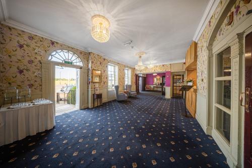 a hallway of a building with a room with at The Clarendon Hotel in London