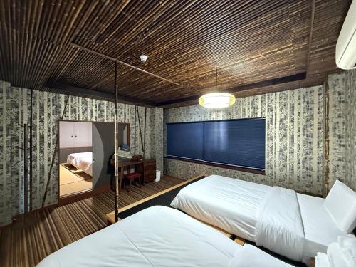 Postel nebo postele na pokoji v ubytování HOTEL COCOA RESORT