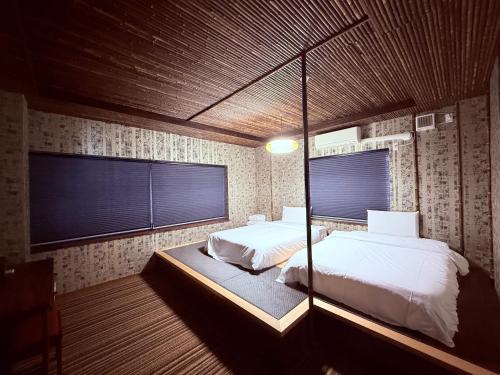 Postel nebo postele na pokoji v ubytování HOTEL COCOA RESORT