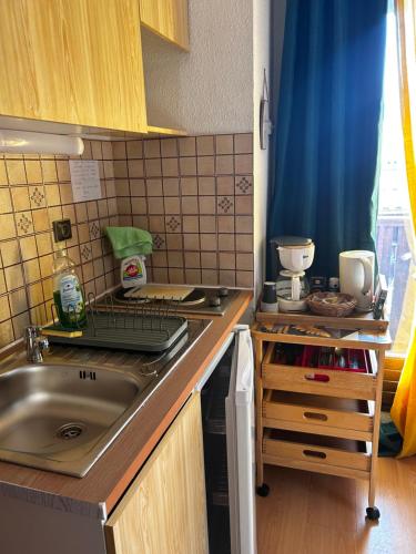 a kitchen with a sink and a counter top at Studio la Gioia in Allos