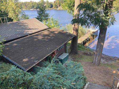 a house sitting on the side of a body of water at Egon in Neuruppin
