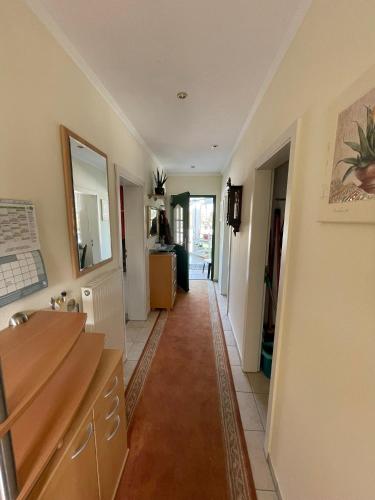 a kitchen with a long hallway with a counter at Egon in Neuruppin